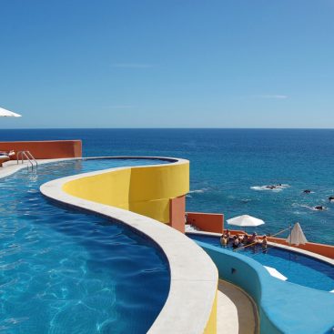 a luxury pool. by the ocean.